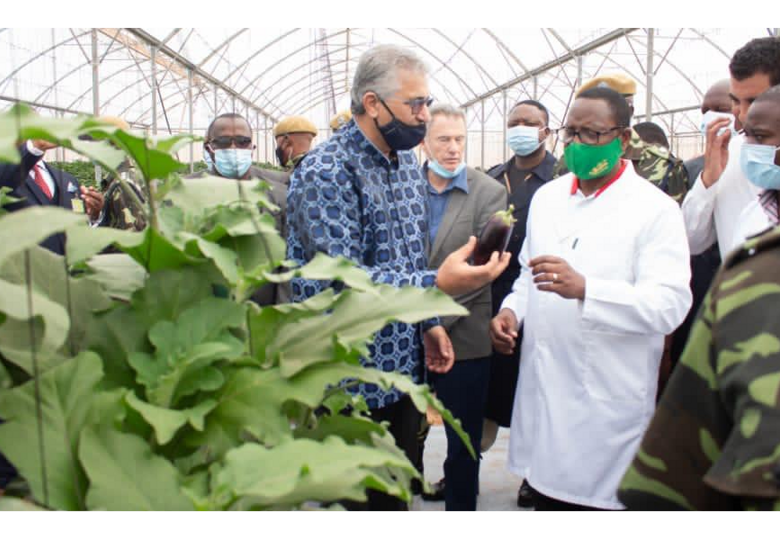 Arkelicom stakeholders inside a greenhouse facility in Malawi.